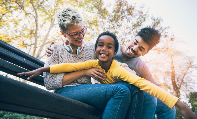 happy couple spending time with their daughter